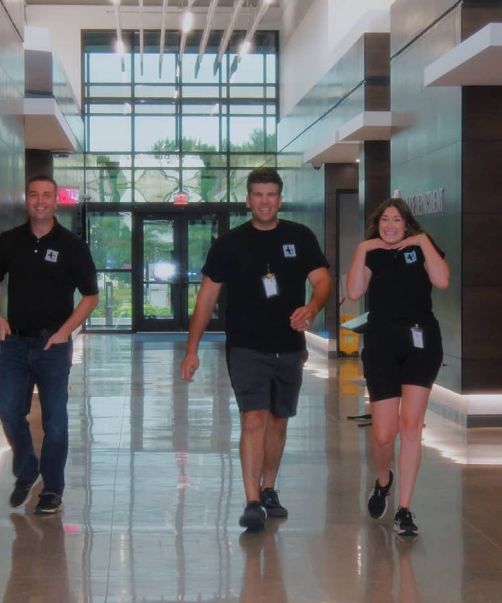 Jeffries Cleaning professionals walking in hall of commercial property